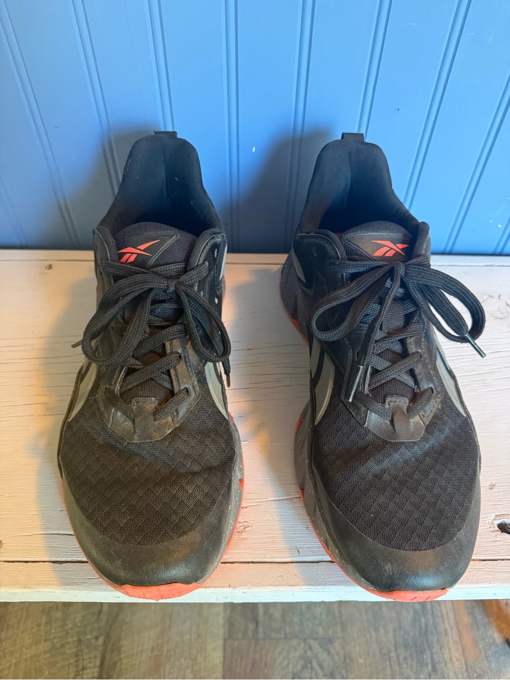 Reebok Black Sneakers with Orange Accents
